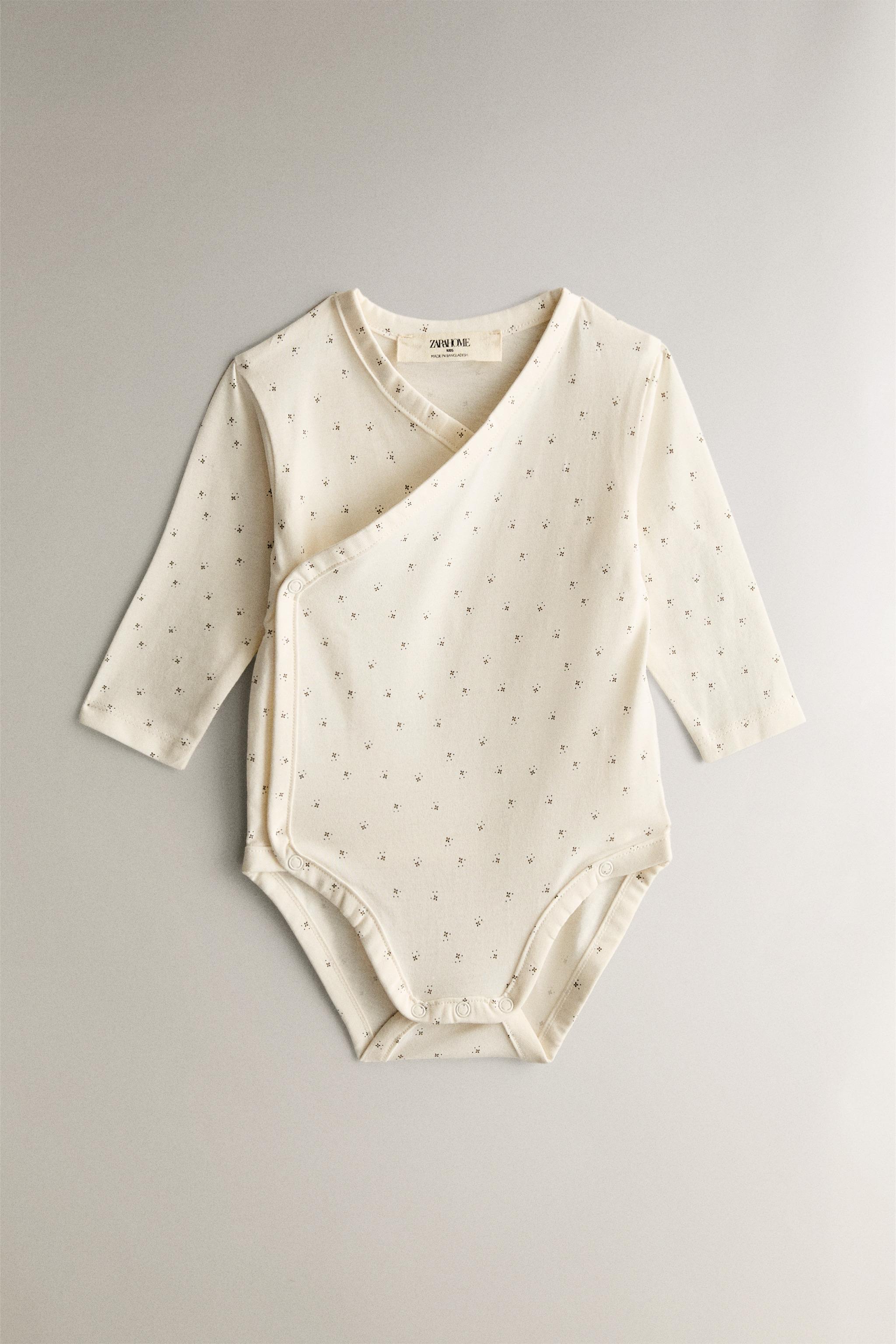 SET OF PRINTED BABY BODYSUITS